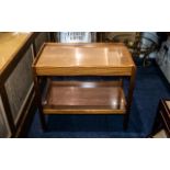 A Teak Two Shelf Trolley 1950's, raised on square legs with casters, height 26.5" x 29.