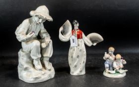 A Small Collection of Pottery to include a large Russian Porcelain figure of a seated boy 33 cms in