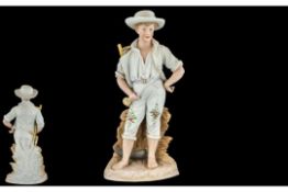 A German Bisque Figure, of a farm boy, with a scythe. Height 15".