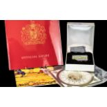 Buckingham Palace Interest - A Limited Edition Enamel Box, the hinged lid showing an image of