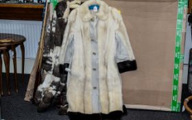 Ladies Mink & Leather Coat, full length in cream fur with brown fur trim to hem and cuffs,
