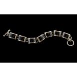 A Vintage Sterling Silver Well Made Bracelet Set with Seven Polished Black Stones,