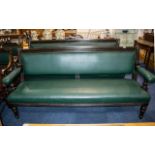Pair of Antique Mahogany Framed Green Leather Club Sofas with open arms, supported on turned legs,
