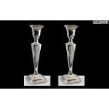 Elizabeth II Pair of Sterling Silver Candlesticks of Pleasing Proportions.