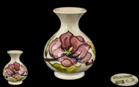 Moorcroft - Globular Shaped Tubelined Vase ' Magnolia ' Pink on Cream Ground.