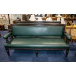 Pair of Antique Mahogany Framed Green Leather Club Sofas with open arms, supported on turned legs,