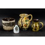 A Collection of Studio Style Pottery 4 items in total. Two jugs, one tea light holder and one