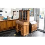 A Small Golden Oak Tambour Fronted Fitted Roll Top Desk, with a matching leaded glass cupboard