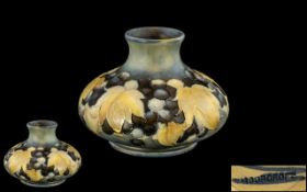 William Moorcroft Signed Small Salt Glaze Squat Vase ' Leaves and Blue Berries ' Design. c.1930's.