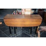 G Plan Tola Drop Leaf Dining Table, 1950's ebonised legs with brass casters.