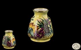 Moorcroft Small Enamelled Cabinet Vase, hand painted to the body with Autumn forest fruits,