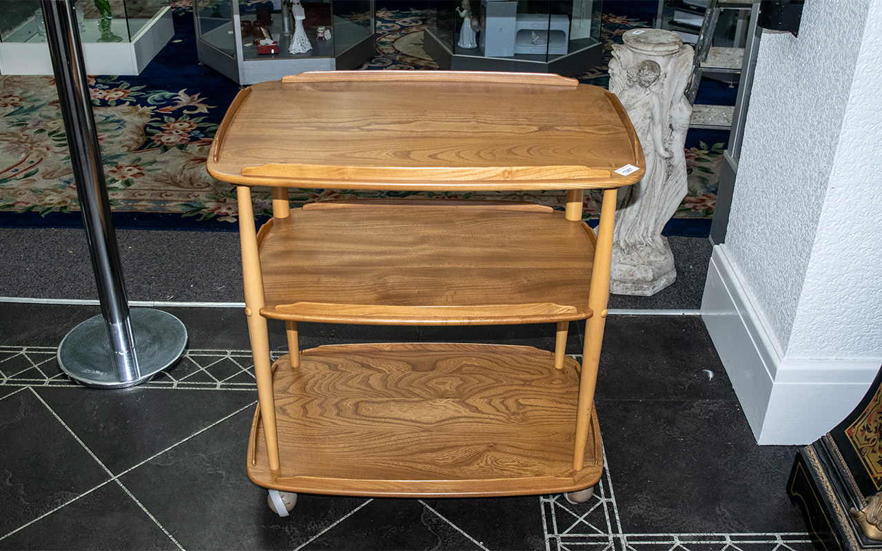 Ercol Three Tier Trolley, with chamfered galleries, on turned supports. Height 30", 28" x 18".