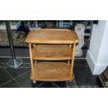 Ercol Three Tier Trolley, with chamfered galleries, on turned supports. Height 30", 28" x 18".