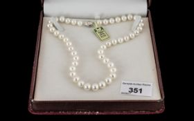 String of White Cultured Pearls Well Matched with Clasp. 15 Inches In length. Boxed.