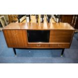 G-Plan Tola Teak Sideboard, circa 1950's ebonised legs, sliding doors and two short drawers,