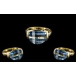18ct Gold - Attractive and Good Quality Blue Topaz Set Dress Ring. The Blue Topaz of Contemporary