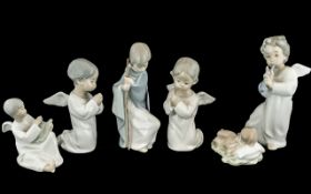 Collection of Five Lladro Figures, comprising three winged angels, one 7'' tall playing a flute, and