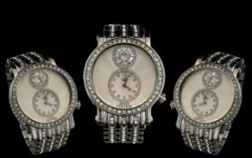 Ladies Juicy Couture Watch, with silver crystal decorated strap, a large crystal on face,