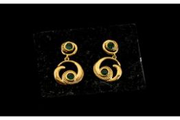 Emerald 'Wave and Circle' Drop Earrings, each earring comprising a deep green emerald set in a