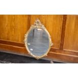 Oval Bevelled Glass Mirror in Gold Rococo Style Frame, measures 30" x 21" approx.