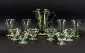 A Vintage Water Jug & Four Glasses, aqua colour glass decorated with gold leaf design,