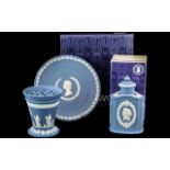 Wedgwood Blue Jasper, three pieces comprising a Silver Jubilee Plate, a grid vase and a lidded pot.