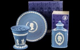 Wedgwood Blue Jasper, three pieces comprising a Silver Jubilee Plate, a grid vase and a lidded pot.