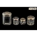 Four Edwardian Embossed Silver Cut Glass Trinket Boxes,