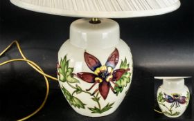 Moorcroft Columbine Table Lamp with shade, tubelined decoration in pink and green on a cream base.