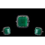 18 Ct Emerald set in 925 Silver Ring with 0.60 Ct Blue Sapphires and 0.45 Ct Rose cut Diamonds.
