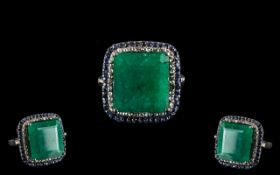 18 Ct Emerald set in 925 Silver Ring with 0.60 Ct Blue Sapphires and 0.45 Ct Rose cut Diamonds.