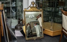 Regency Style Gilt Gesso Mirror of elegant form, surmounted by an urn,