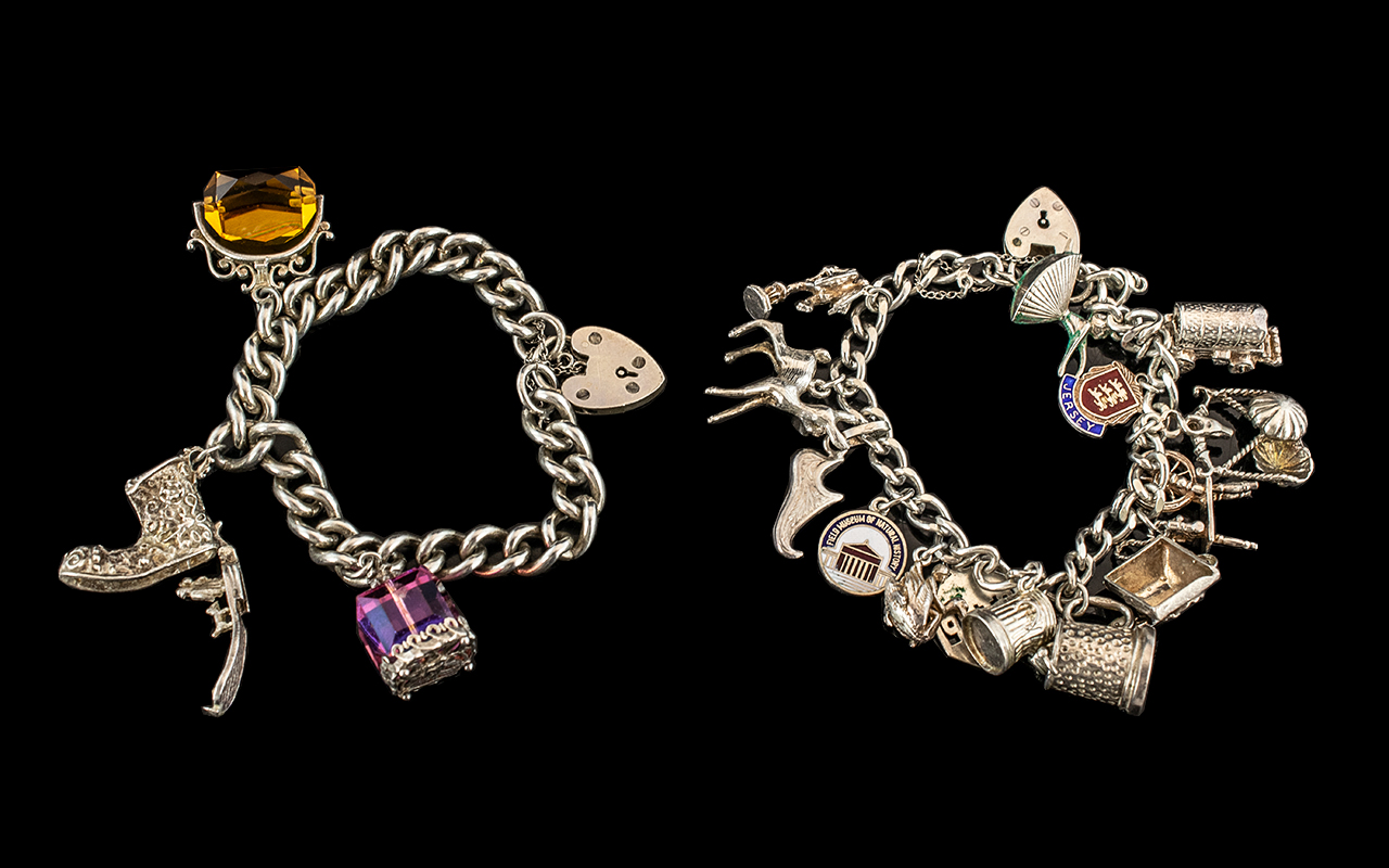 A Vintage Sterling Silver Charm Bracelet Loaded with 13 Silver Charms. All Marked for Silver 925.