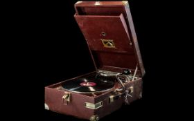 A HMV Portable Gramophone in Maroon with chrome fittings In working order,