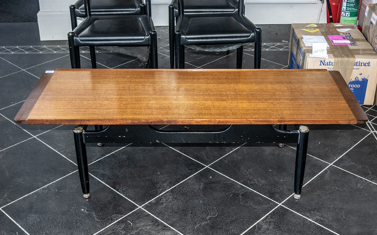G Plan Tola Coffee Table Circa 1950's, ebonised legs and brass casters. Height 15.5'', length 54'' x