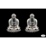 Unusual Silver Buddha Salt and Pepper Set, with Buddha seated on a lotus base; stamped Sterling 950,