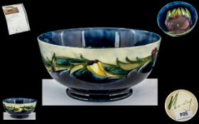 William Moorcroft Signed - Footed Bowl ( Rare ) ' Pansy ' Design on Blue Ground. c.1920 - 1925.