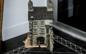 Cumbrian School Miniature House, traditionally built in stone and slate, realistically modelled.