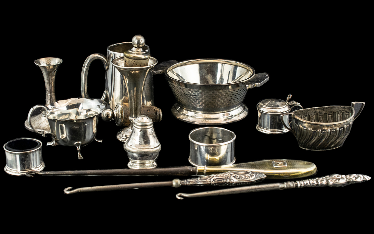 Sixteen Various Silver Items including vases, salts, pepper pots, lace hooks, mug, sugar bowl,