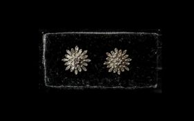 Pair of Diamond Starburst Cluster Stud Earrings, closely set baguette cut diamonds,