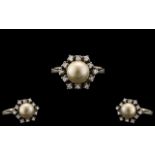 Ladies 14ct White Gold Stylish and Attractive Diamond and Pearl Set Dress Ring. The Central Pearl
