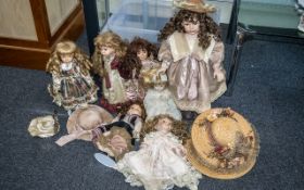 Collection of Seven Dolls dressed in Victorian fashions with stands, together with five straw hats