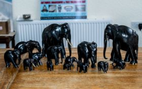 Collection of Twelve Indian Ebony and Ivory Elephants,