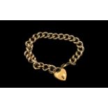 9ct Gold Curb Bracelet With Heart Shaped Padlock. All Links Marked for 9ct - 375. Good Warm Colour.