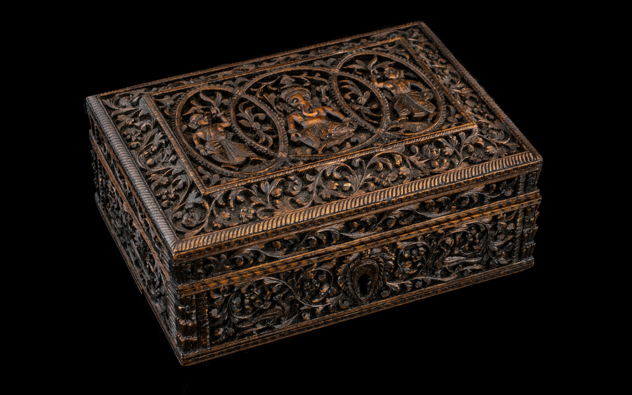 Finely Carved Antique Indian Sandalwood Trinket Box, decorated to the lid with temple maidens and