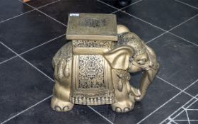 An Oriental Style Pottery Plant Stand in the form of an Elephant. Measures height 16".