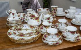 Old Country Roses Tea Service with many extras, comprising Tea Pot, Milk Jug, Lidded Sugar Bowl,