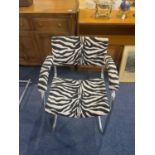 A Pel Chrome Cantilever Bauhaus Style Armchair. Covered in zebra print fabric.