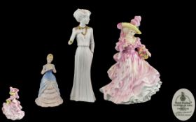 A Trio of Hand Painted Porcelain Figures.