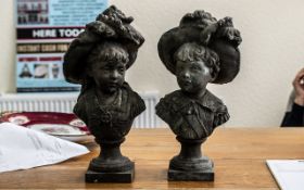 Pair of Antique French Bronzed Metal Busts of a boy and a girl wearing flamboyant feathered hats,